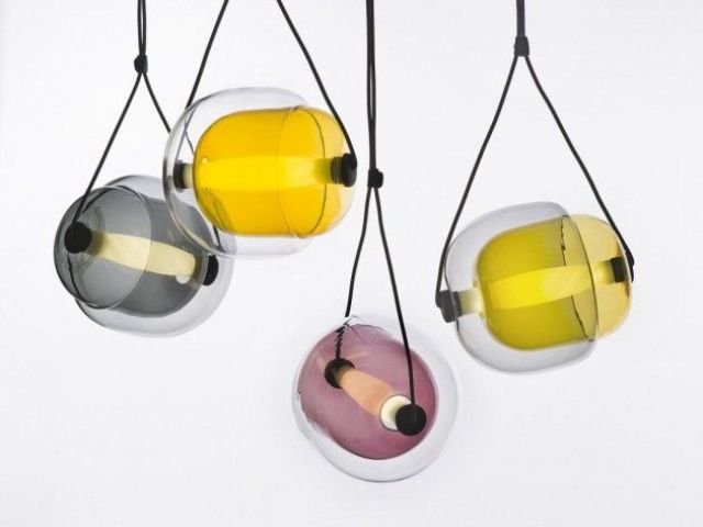 Colorful glass lampshades, long bulbs and black rope to hang the lamps are amazing to accent a modern or mid century modern space