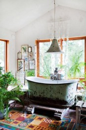 a lovely bathroom design in boho style with large windows
