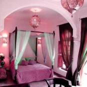 this Moroccan bedroom is given a girlish feel with shades of pink and fuchsia, with bright curtains and a canopy