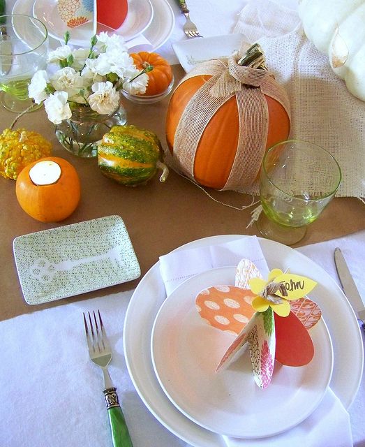 pumpkins and gourds plus some neutral blooms are lovely for Thanksgiving decor, add neutral linens and stylish porcelain