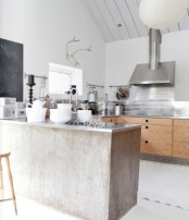 a Scandinavian kitchen with stained cabinets, a shabby chic kitchen island, stainless steel appliances and touches of black
