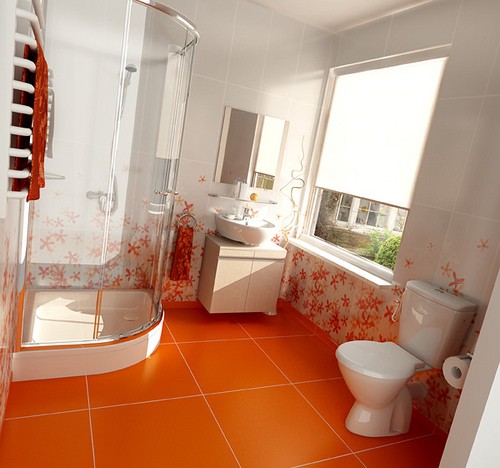 an orange floor with large scale tiles and white and orange flower tiles plus orange towels for a bright modern bathroom