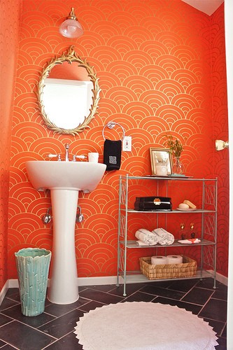 brighten up your bathroom with orange printed wallpaper - wallpaper in bathrooms is a very hot trend