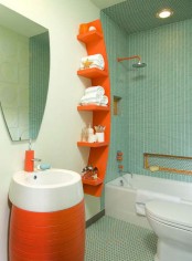a light blue and white bathroom with bright orange touches – a catchy modern vanity and a curved shelf plus hardware