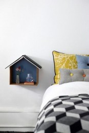 a wall-mounted house-shaped shelf allows to store some stuff and will be a veyr cool and creative idea for a kids’ room