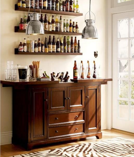 A vintage dark stained home bar with matching open shelves is a great idea for a vintage space, all the glasses and bottles are stored with comfort