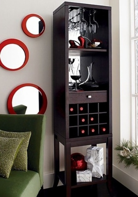 A tall dark stained home bar is a great idea to save floor space, mirror open compartments, drawers and a wine bottle storage unit is ideal for a small space