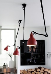 pendant lamps with red shades that remind of traditional table lamps look very chic and very stylish