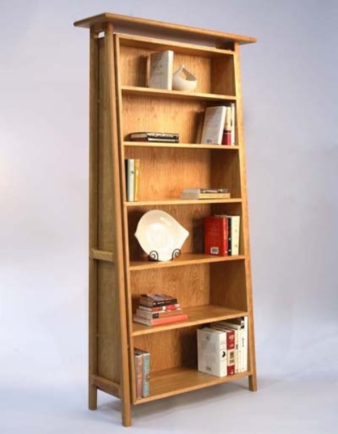 A light colored wood ladder style bookcase with shelves is a stylish idea that adds interest with its shape