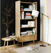 a light-colored wooden bookcase with open shelves is a very chic idea that doesn’t catch an eye too much