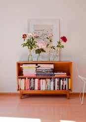 a bright orange wood low bookcase features no doors is a colorful touch to your space