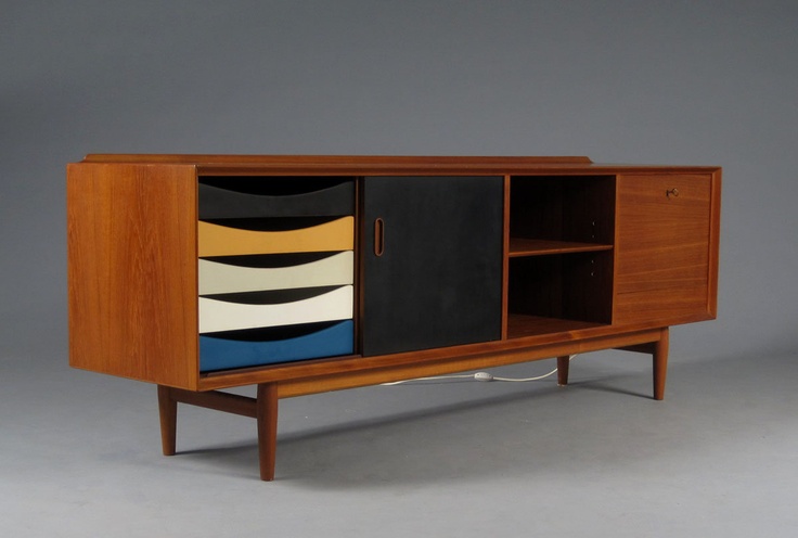 A contrasting mid century modern sideboard with open storage compartments, doors and catchy drawers with cutout handles is a lovely idea for a mid century modern sideboard