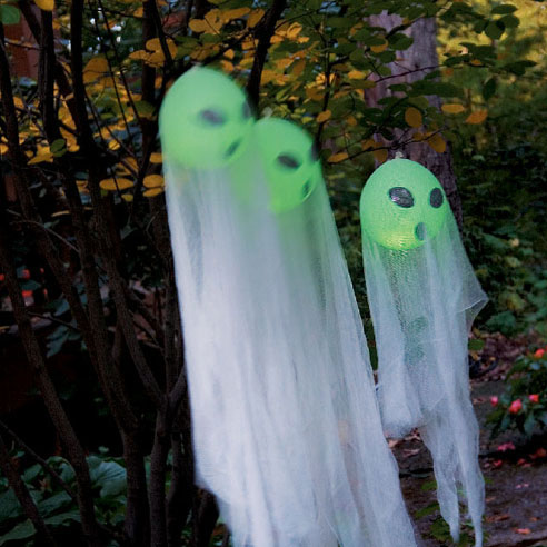 Add some ghostly brightness to your front yard. These adorable ghosts would welcome your guests with a twist. Besides they are easy and cheap to make.