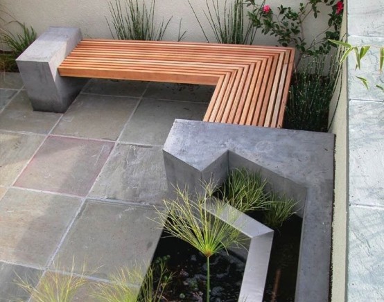a modern outdoor space with a built-in bench of wood and concrete and tiered planters is a lovely idea for a modern space