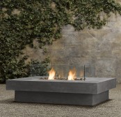 a concrete and glass fireplace liek this one can be rocked both indoors and outdoors and will fit a contemporary or minimalist space