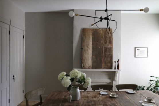 Peaceful Dining Room With Farmhouse Furniture And Industrial Lights