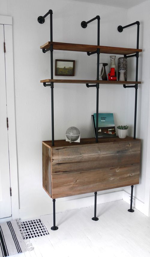 a shelving and storage unit of black pipes and reclaimed wood is a lovely idea for an awkward nook, it's a smart solution