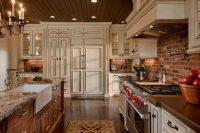 a neutral kitchen with shaker style cabinets, a red brick backsplash, a stained kitchen island with a stone countertop and vintage appliances