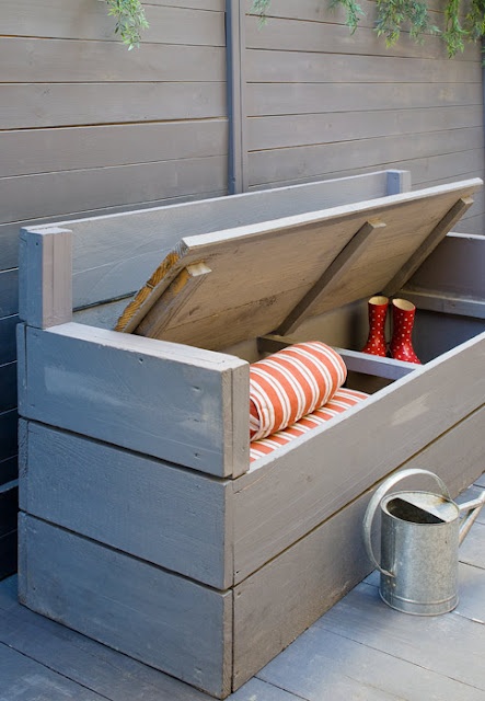 a grey painted wooden bench with storage space inside is an easy DIY project