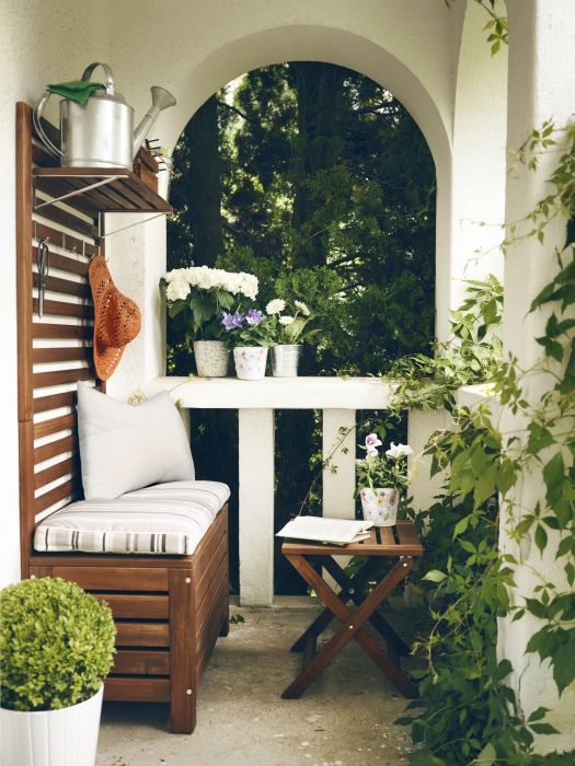 a bench with a storage space inside and a small shelf over it will fit even a tiny balcony