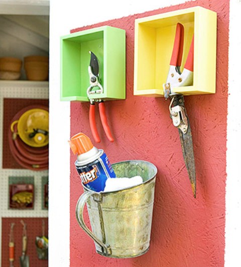 bright painted box shelves for tools and a metal bucket for storing are a creative idea for shed storage