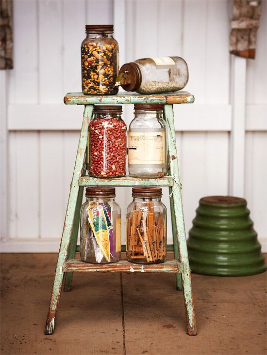 a simple vintage ladder can accommodate some stuff in jars or baskets and can be taken away when not in need