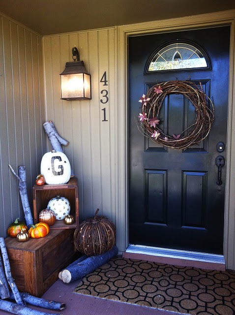 A simple grapevine wreath is an awesome way to decorate your front door.