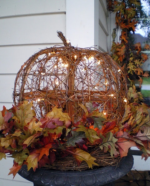 Make a DIY twig pumpkin with string lights inside.