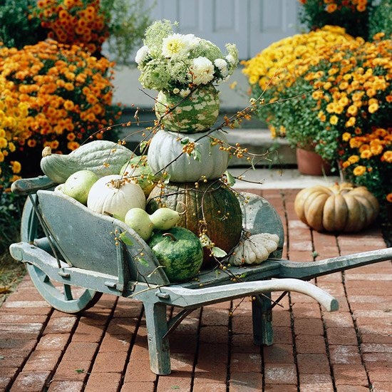 Arrange a Fall pumpkin centerpiece close to your porch.