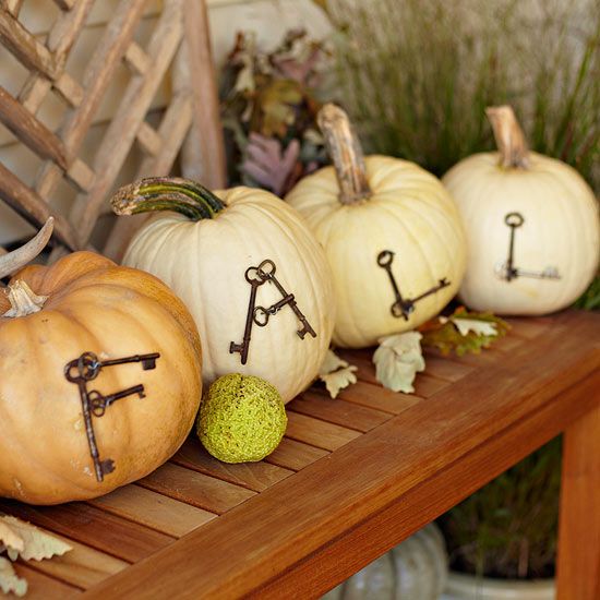 natural pumpkins with letters made of vintage keys are a cool fall decoration for indoors or outdoors