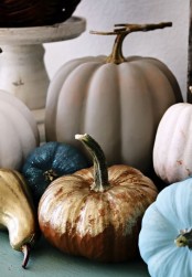 natural pumpkins painted in non-typical for the fall colors – blue, blush, grey, navy and gold