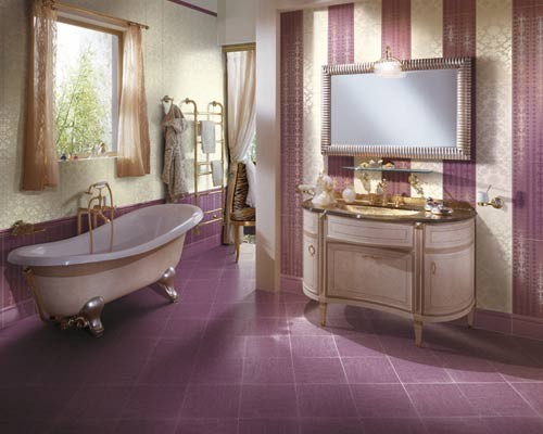 a cheerful retro-inspired purple and neutral bathroom with a striped wall, a purple tile floor and a vintage clawfoot bathtub plus curtains