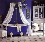 a vintage-inspired purple and white bathroom with a mosaic tile floor, a canopy of curtains and a white buffet