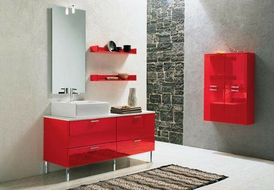 A contemporary bathroom done in grey and red, with bright furniture and lots of light  natural and not only