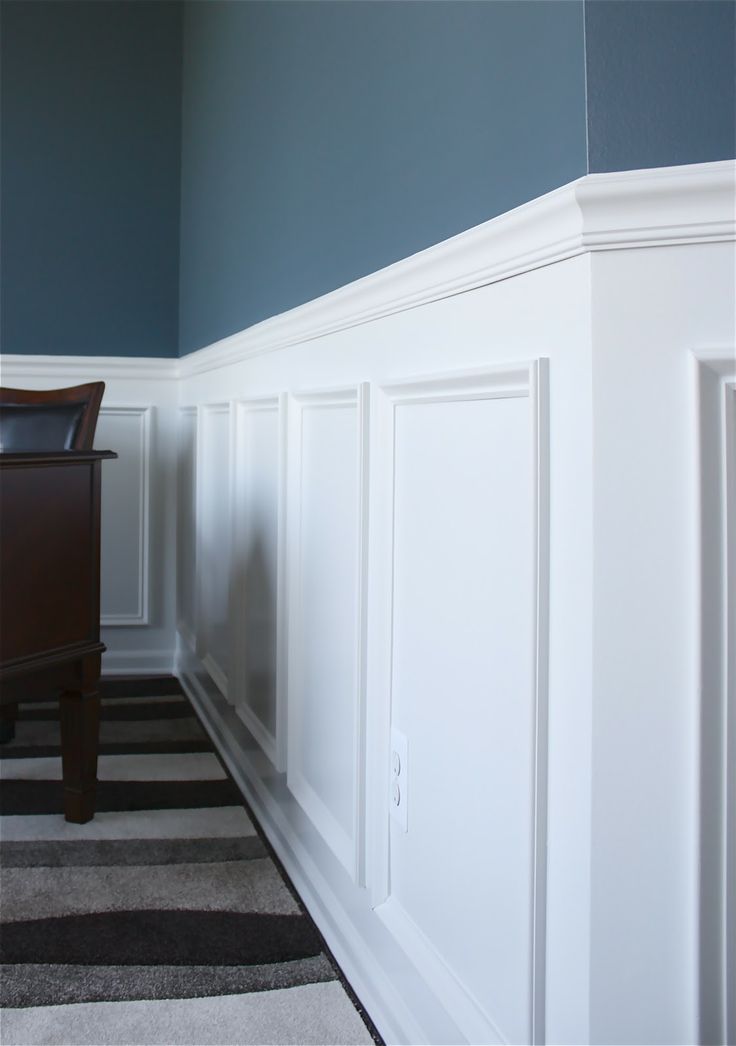 Navy walls and white molding are a great contrasting combo that will make your space a more lightweight and airy looking one