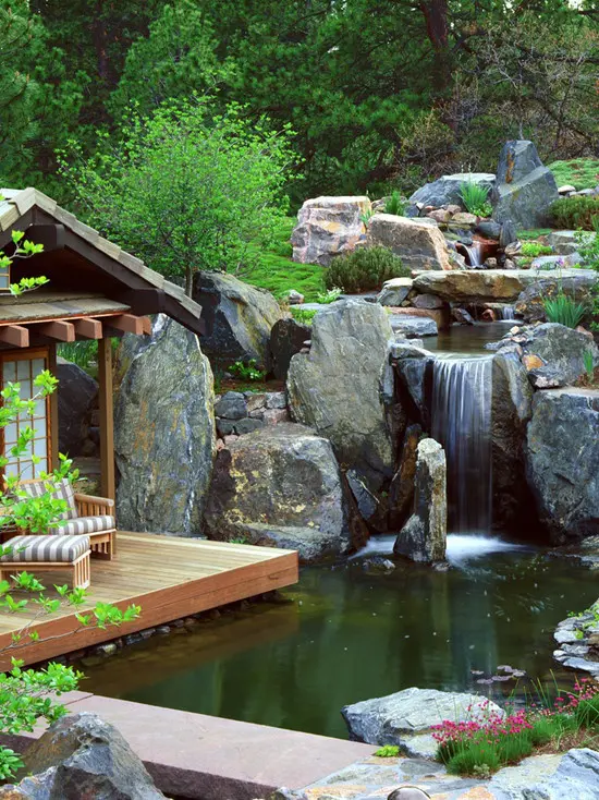 Rough rocks,  a pond and lots of greenery make this little terrace a perfect place to admire the beauty of Nature.