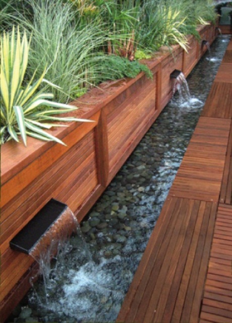 This awesome contemporary waterfall idea could be used to edge your terrace or patio.