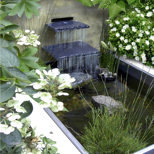 Contemporary waterfall would make even a small pond  shine.