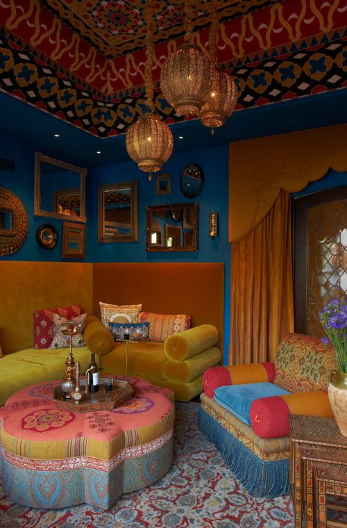 a super bright Moroccan living room with all things Morocco, adorable lanterns and upholstered furniture