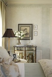 a neutral and refined vintage bedroom with exquisite furniture, artworks and printed textiles is a lovely space to get inspired