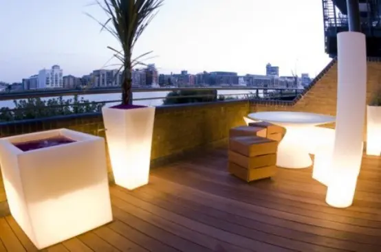 Glowing outdoor seating and planters are perfect to make your terrace more glam.