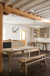 Rustic Kitchen With An Extensive Use Of Rough Wood