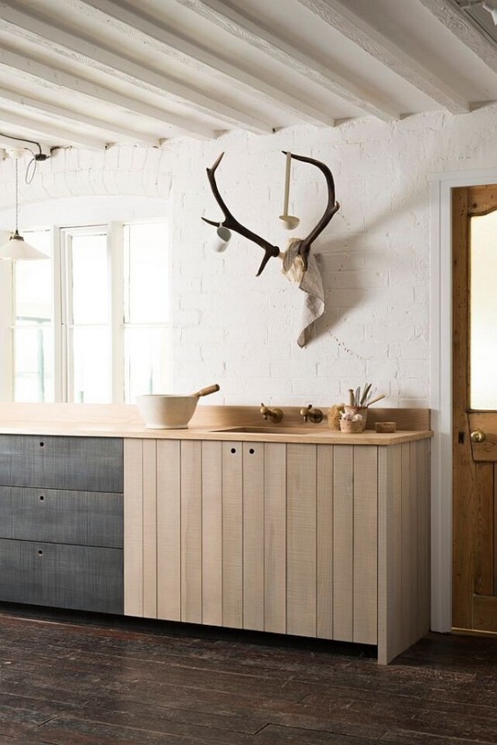 Rustic Kitchen With An Extensive Use Of Rough Wood