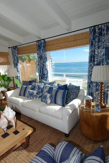 a bright coastal living room in blue and white, with many woven details and touches of jute and wood