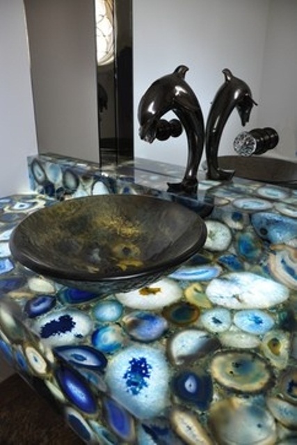 a gorgeous lit up geode vanity inspired by the colors of the sea plus a dolphin fixture
