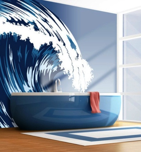 a nautical bathroom with a navy bathtub and a gorgeous waves wall mutral for a chic space