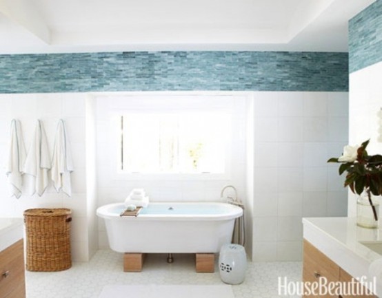 a beachy bathroom with blue and white decor, wooden furniture and baskets for storage