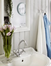 Shabby Chic Bathroom With A Hearth And A Sideboard