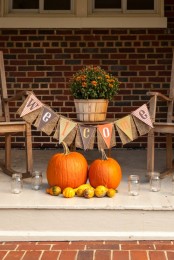 a burlap banner with bright fabric and stenciled letters is a lovely and bright decoration for the fall and Thanksgiving