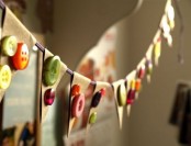a paper banner decorated with fall-colored buttons all over is a stylish decor idea for the fall or Thanksgiving, it’s easy to make and won’t cost much